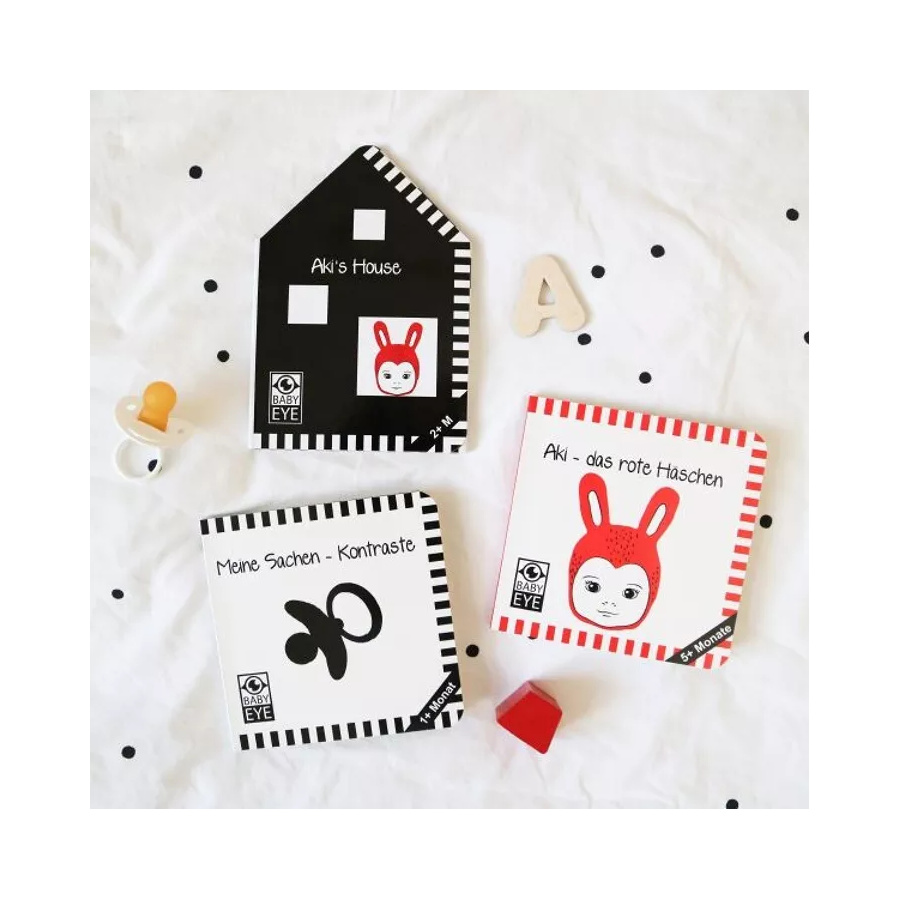 Livre contrasté "Aki's House" | Rouge et noir pour bébé 2 mois+ | Montessori tummy time | lesminis.fr