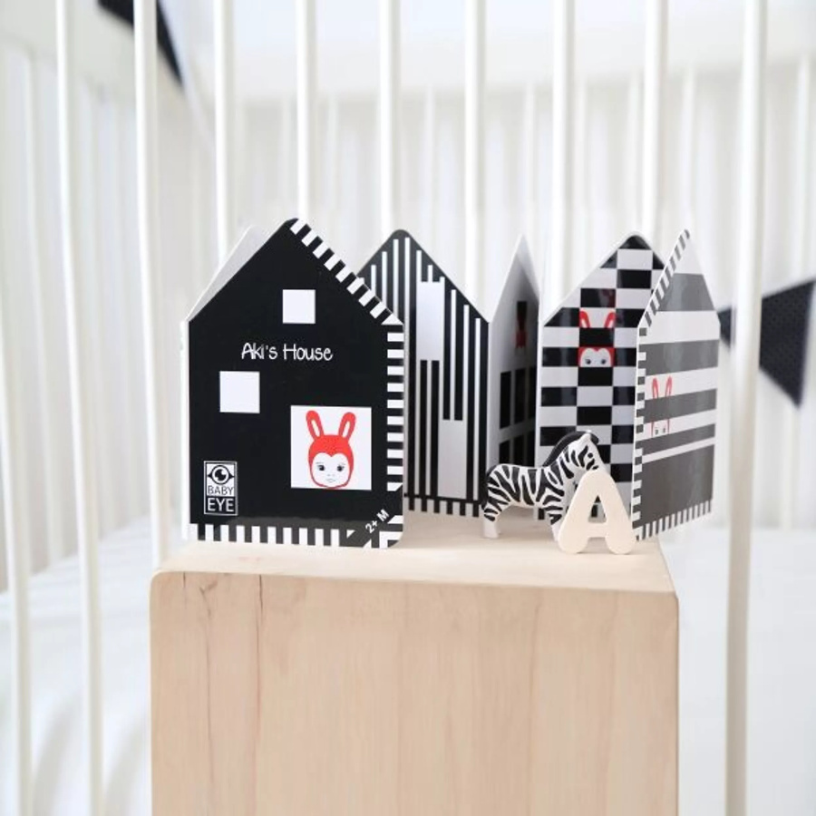 Livre contrasté "Aki's House" | Rouge et noir pour bébé 2 mois+ | Montessori tummy time | lesminis.fr