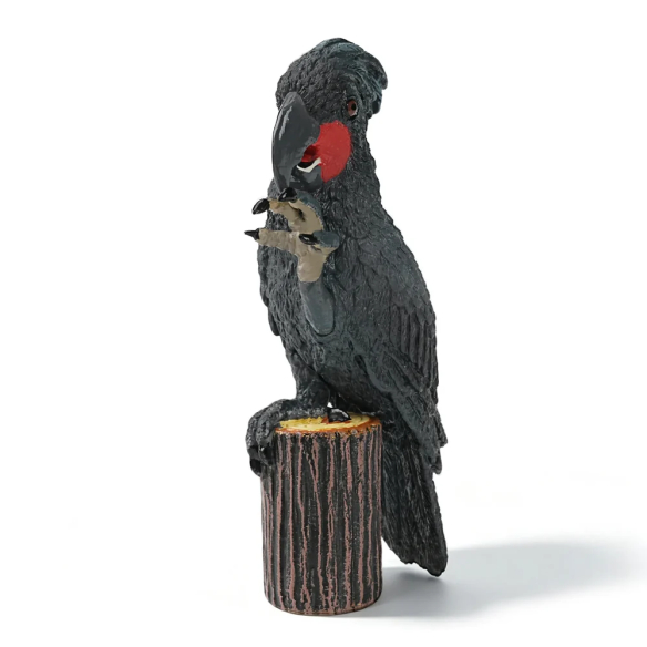 Figurine cacatoès noir (microglosse) sur sa souche