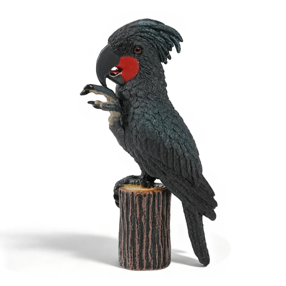 Figurine cacatoès noir (microglosse) sur sa souche