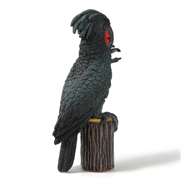 Figurine cacatoès noir (microglosse) sur sa souche