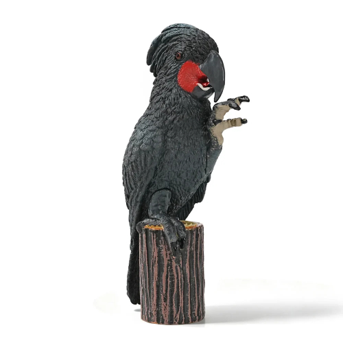 Figurine cacatoès noir (microglosse) sur sa souche